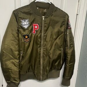 Green puffy jacket with patches